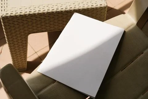 Empty magazine mockup on plastic table tile floor in the room, shadow overlay Stock Photos