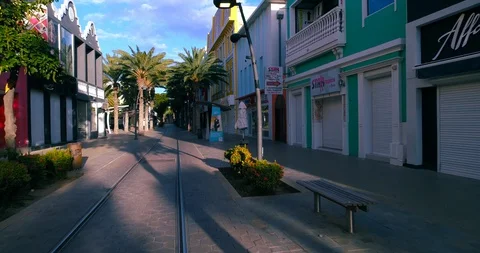 Empty mainstreet flyin mid slowmotion Aruba, Caribbean Stock-Footage 128926475