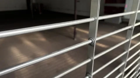 An Empty Mall Store behind Barred off Front Stock Footage 323762820