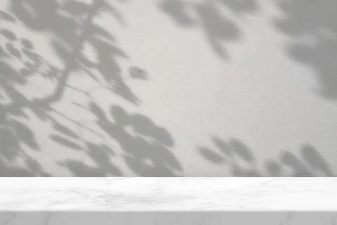 Empty Marble Table with Tree Shadow on Concrete Wall Texture Background Stock Photos