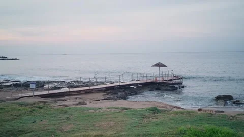 Empty marina dock with sun umbrella on cloudy early morning day in Cyprus island Stock Footage 304461551