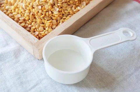 Empty Measuring Spoon with Dried Soybeans Stock Photos