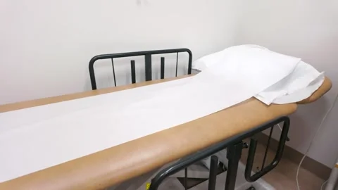 Empty Medical Exam Table in Clinical Doctor Office Treatment Room Stock Footage 330446558