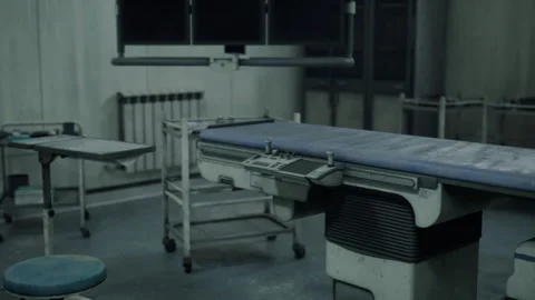 Empty medical operating space with aged fixtures and shadows Stock Footage 338338563