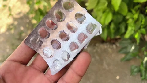 Empty Medicine Blister Pack in Hand – Medical Waste and Healthcare Concept Stock Footage 318840359