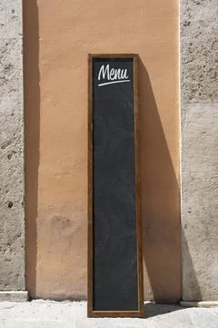 Empty menu board stand and outdoor cafe Stock Photos