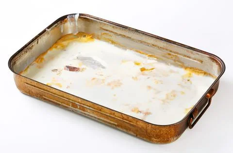 Empty metal baking dish with residue Stock Photos
