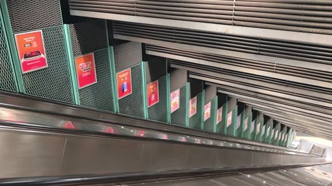 Empty metal escalator extending underground in Stadion station, Stockholm Stock Footage 340274327