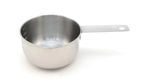 Empty metal measuring cup Stock Photos