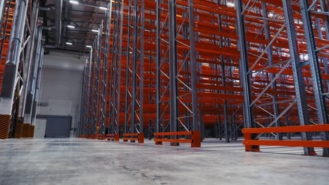 Empty metal racks installed in modern spacious storehouse Stock Footage 120654390