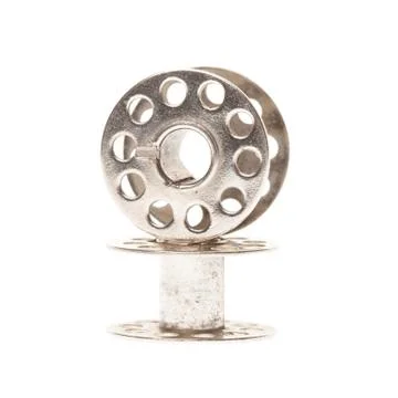 Empty metal thread spools Stock Photos