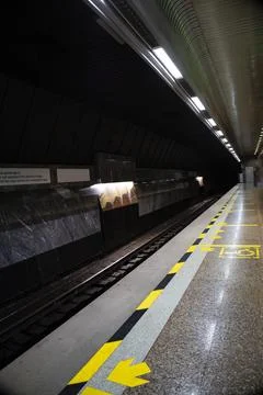 Empty metro station, far from the train. Stock Photos