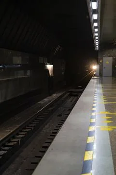Empty metro station, far from the train. Stock Photos