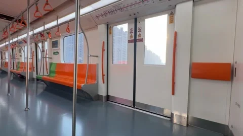 Empty Metro Train Interior with Moving Sunlight and Colorful Seats Stock Footage 331905087