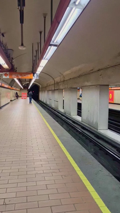 Empty mexico city subway station platform with train approaching Stock Footage 337057731