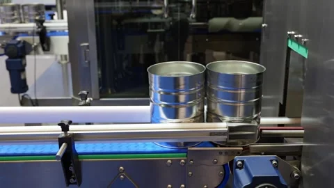 Empty milk powder tins running on an automated filling line for testing Stock Footage 336733839
