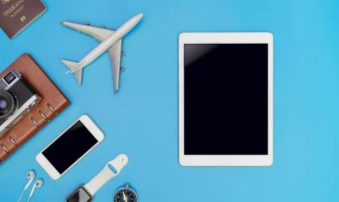 Empty mobile tablet screen for mock up in travel concept with travel gadget o Stock Photos