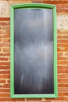 Empty mockup from school board on brick wall background. Stock Photos