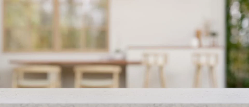 Empty mockup space on a white tabletop with a blurred background of a moder.. Stock Illustration