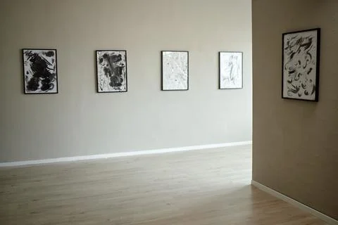 Empty Modern Art Gallery Displaying Abstract Paintings on Wall Stock Photos