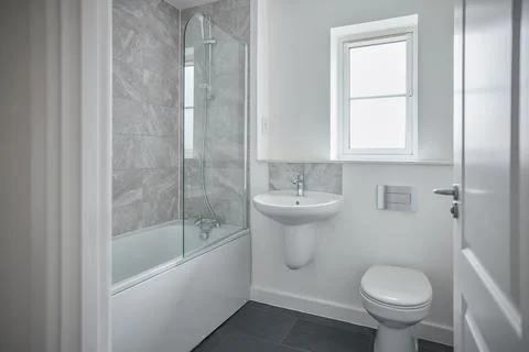 Empty Modern Bathroom With Shower Fitted In New Home On Moving In Day Stock Photos