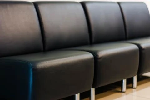 Empty modern black leather sofa Stock Photos