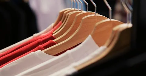 Empty modern boutique with basic clothes Stock Photos