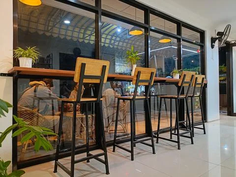 Empty modern cafe interior with chairs and tables Stock Photos