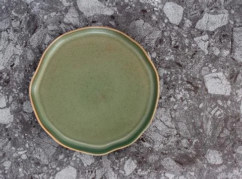 Empty modern ceramic plate on marble table background ,top view Stock Photos