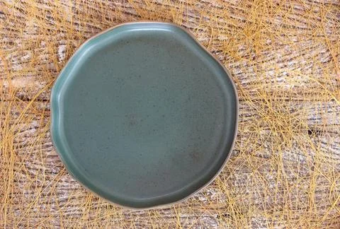 Empty modern ceramic plate on wood table background ,top view Stock Photos
