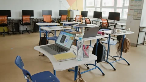Empty Modern Classroom with Laptops on Desks Waiting for Students Stock Footage 342820541