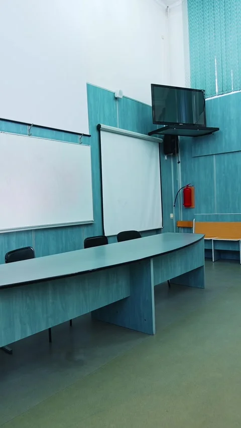 Empty modern conference room with presentation screens, large table and cha.. Stock Footage 337482314