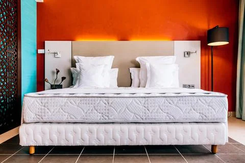 Empty modern double bed hotel room Stock Photos