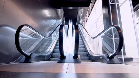 Empty modern escalator stairs. Moving staircase running up and down Stock Footage 91006967