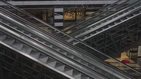 Empty modern escalators moving continuously inside a building with marble and 스톡 동영상 331565085