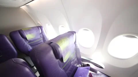 Empty modern interior with seats in business class aircraft Stock Footage 276365206