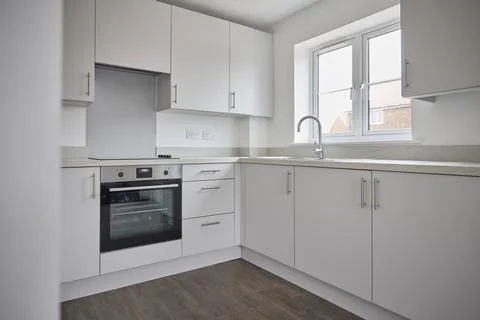 Empty Modern Kitchen Fitted In New Home On Moving In Day Stock Photos