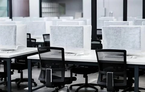 Empty modern office space with desks and chairs Stock Photos