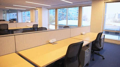Empty modern open space corporate office with wooden tables, chairs windows Vidéo 126939850