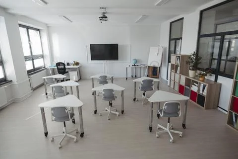 Empty modern primary school classroom ready for students. Stock Photos