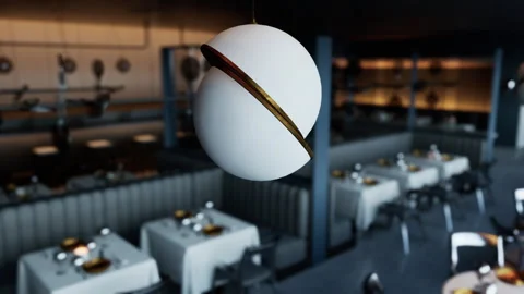 Empty modern restaurant with elegant decor and suspended lighting fixtures 動画素材 304463980