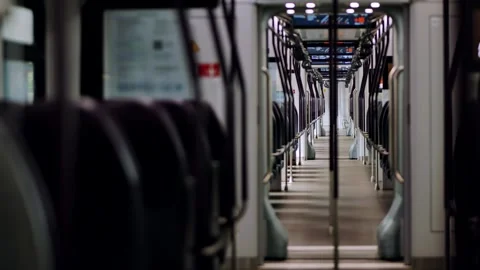 Empty modern train car showing seats and handles Vidéo 314576664