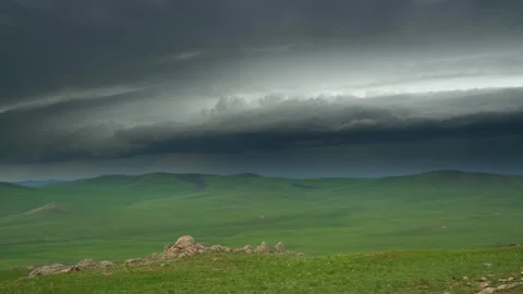 Empty Mongolian grasslands before rain with dark storm clouds - Dramatic Weather Stock Footage 339722053