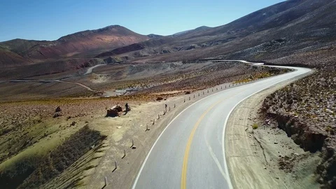 Empty mountain highway with blue sky, AERIAL VIEW CUESTA DEL LIPAN ALTIPLANO Stock Footage 88344235