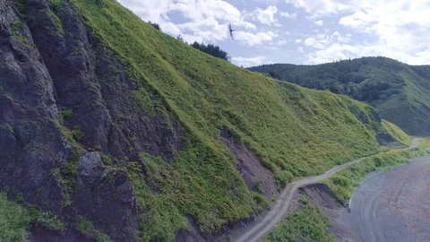 Empty mountain road and the sea aerial Stock Footage 80080543