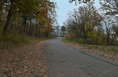 Empty mountain road at cloudy day during autumn time Stock Photos