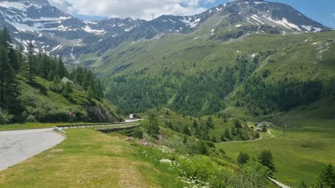 Empty mountain road crossing Simplon Pass in Valais, Switzerland, with partly Stock Footage 340943787