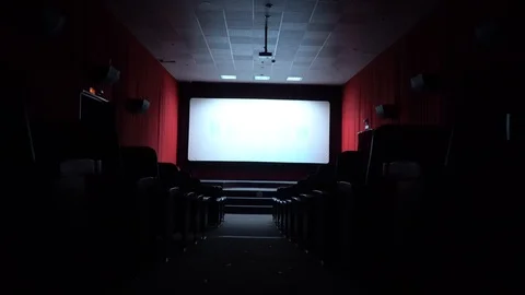 Empty movie theater, watching a movie. cinema hall. Viewers watch a movie in a Stock Footage