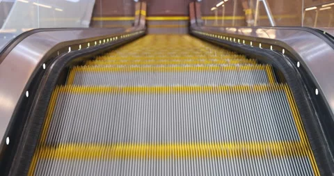 Empty moving escalator stairs in the terminal Stock Footage 167925228