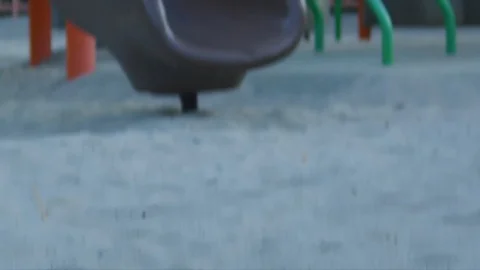 An empty moving swing at a playground Stock Footage 122183152